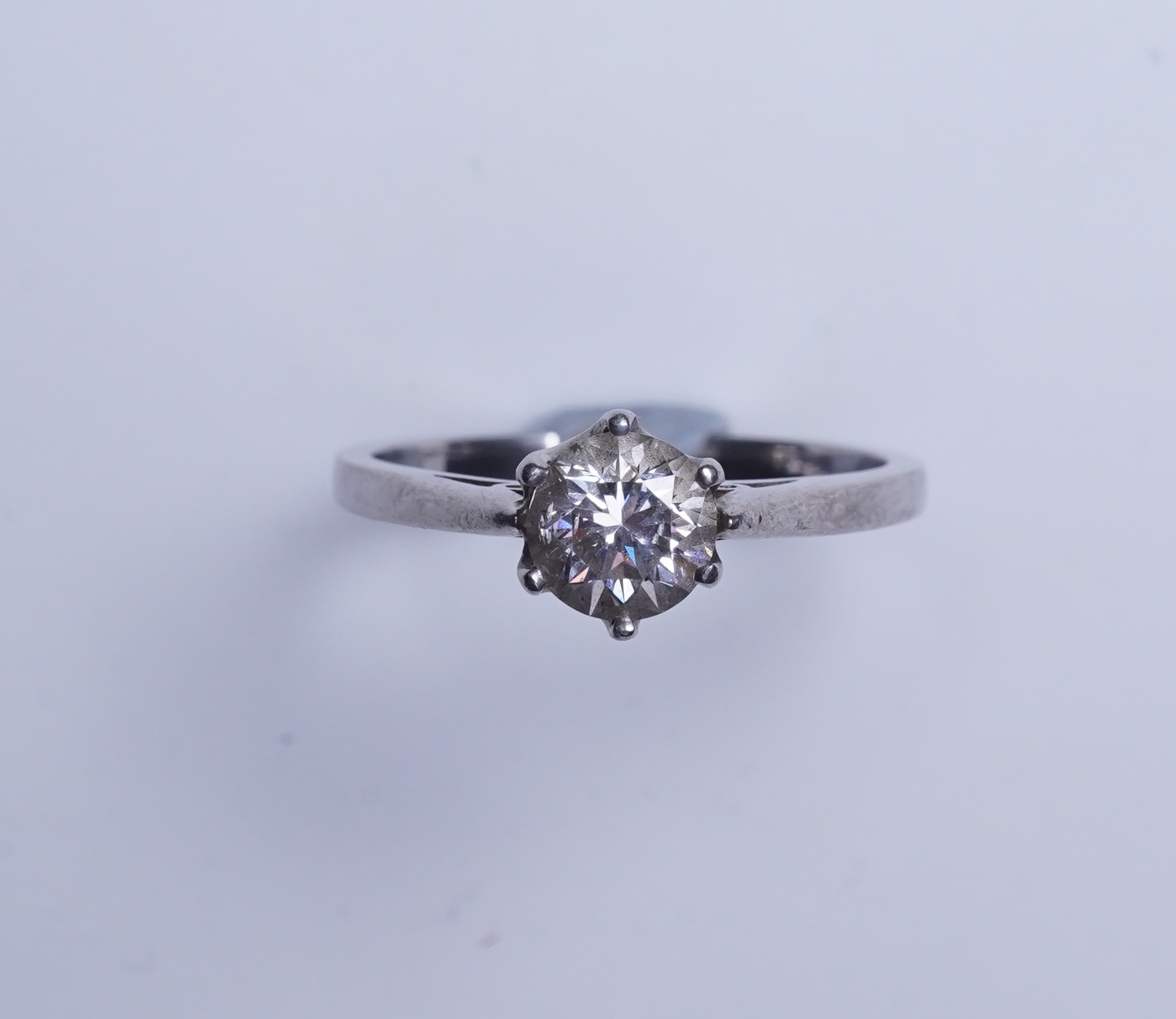 A diamond solitaire ring